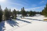 Discover the serene beauty of this stunning property, nestled amidst a picturesque winter landscape.