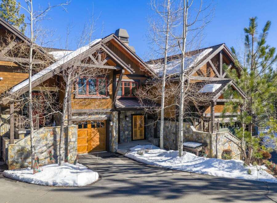 This stunning mountain home boasts exquisite architectural details and a prime location.