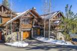 This stunning mountain home boasts exquisite architectural details and a prime location.