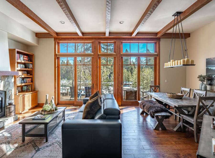 Experience luxury living in this stunning property, featuring expansive windows that frame breathtaking views of the surrounding natural landscape.