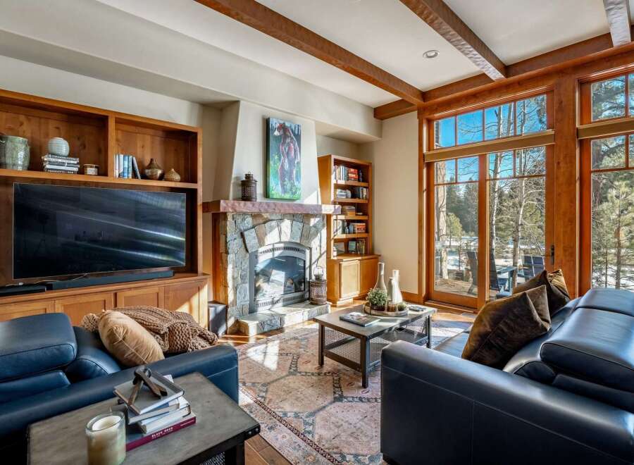 Experience luxury living in this stunning property featuring a cozy fireplace, perfect for chilly evenings.
