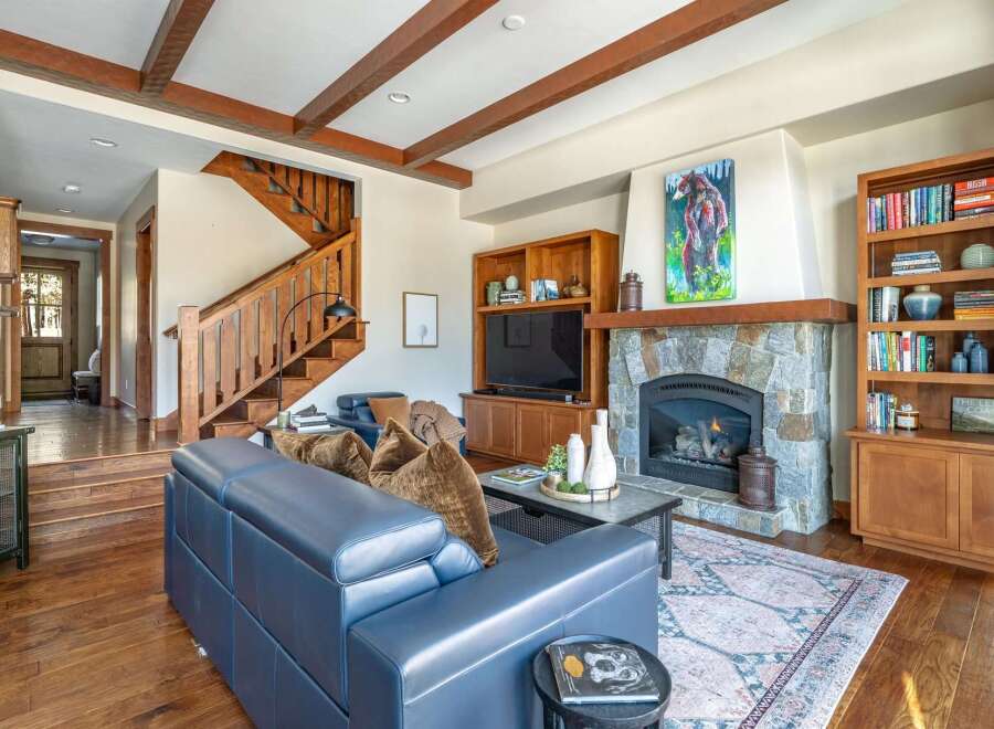 This stunning living room boasts a cozy fireplace, perfect for chilly evenings.