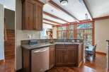 This stunning kitchen boasts custom cabinetry, granite countertops, and stainless steel appliances.