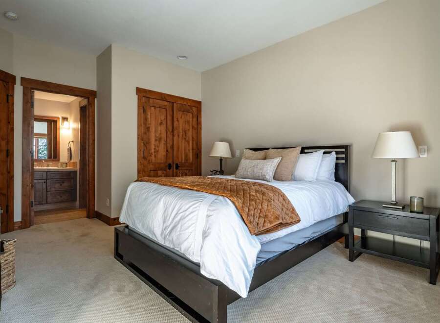 Step into this inviting bedroom, showcasing a blend of rustic charm and modern comfort.