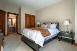 Step into this inviting bedroom, showcasing a blend of rustic charm and modern comfort.