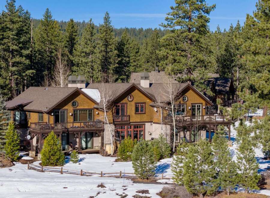 Nestled amidst a serene, snow-covered landscape, this stunning property offers a perfect blend of luxury and natural beauty.