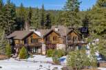 Nestled amidst a serene, snow-covered landscape, this stunning property offers a perfect blend of luxury and natural beauty.