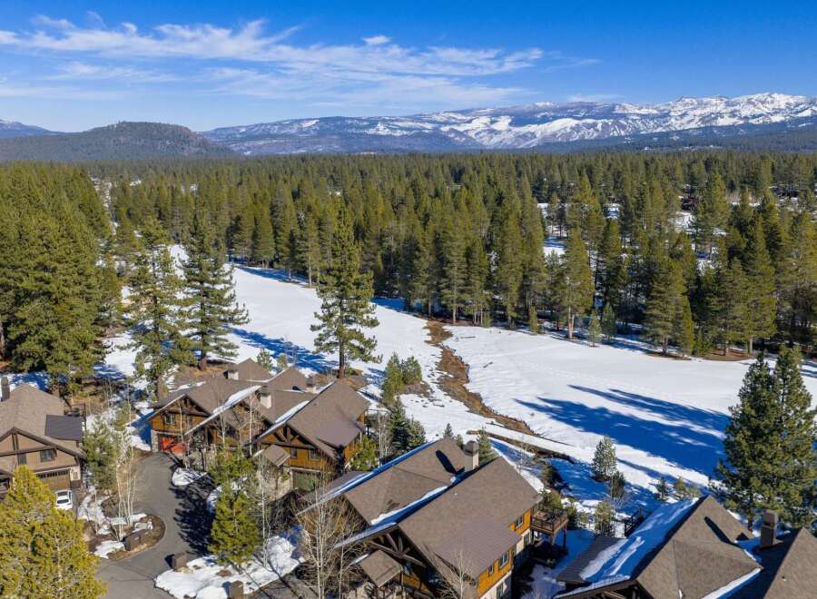 Nestled amidst a picturesque winter landscape, this stunning property offers a serene retreat.