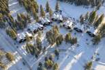 Nestled amidst a snowy landscape, this stunning property showcases a collection of charming homes.