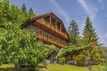Discover the charm of this stunning wooden chalet nestled in a picturesque setting.