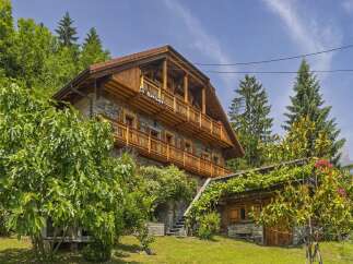 Discover the charm of this stunning wooden chalet nestled in a picturesque setting.