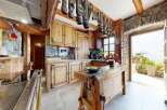 Step into a rustic kitchen that exudes charm and character.