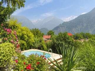 Escape to your own private oasis with this stunning property! Featuring a beautiful pool surrounded by lush greenery and breathtaking mountain views, this home offers the perfect blend of luxury and tranquility.