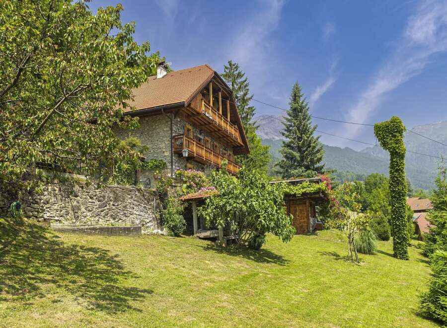 Discover the charm of this stunning stone house nestled in a picturesque setting.
