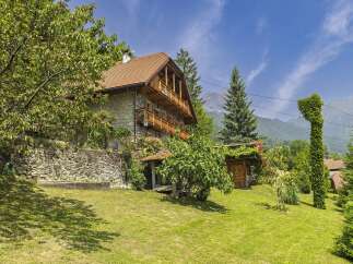 Discover the charm of this stunning stone house nestled in a picturesque setting.