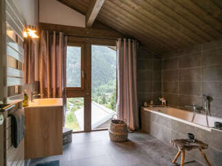 This stunning bathroom boasts a luxurious design with a modern touch.