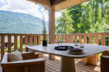 Enjoy breathtaking mountain views from this stunning outdoor dining area.