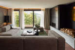 Experience luxury living in this stunning property, featuring a spacious living room with breathtaking views.