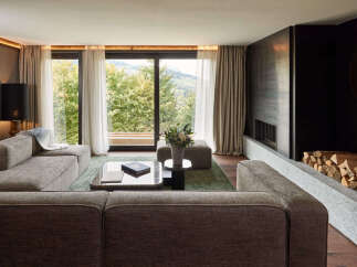 Experience luxury living in this stunning property, featuring a spacious living room with breathtaking views.