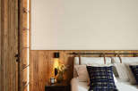 Experience rustic elegance in this cozy bedroom.