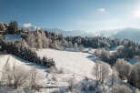 Nestled in a serene winter wonderland, this property offers breathtaking views of snow-covered landscapes and majestic mountains.