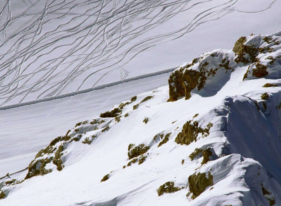 Explore the breathtaking beauty of this snow-covered mountain landscape.