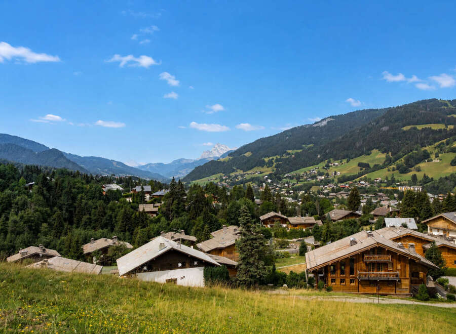 Experience the charm of alpine living in this picturesque village nestled amidst rolling green hills and majestic mountains.