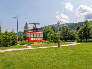 This charming property boasts a unique feature: a cable car station, adding a touch of alpine allure.