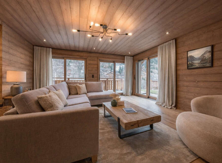 Step into luxury with this stunning living room, featuring exquisite wooden paneling that exudes warmth and sophistication.
