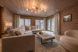 Step into luxury with this stunning living room, featuring exquisite wooden paneling that exudes warmth and sophistication.