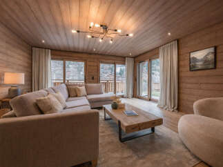 Step into luxury with this stunning living room, featuring exquisite wooden paneling that exudes warmth and sophistication.