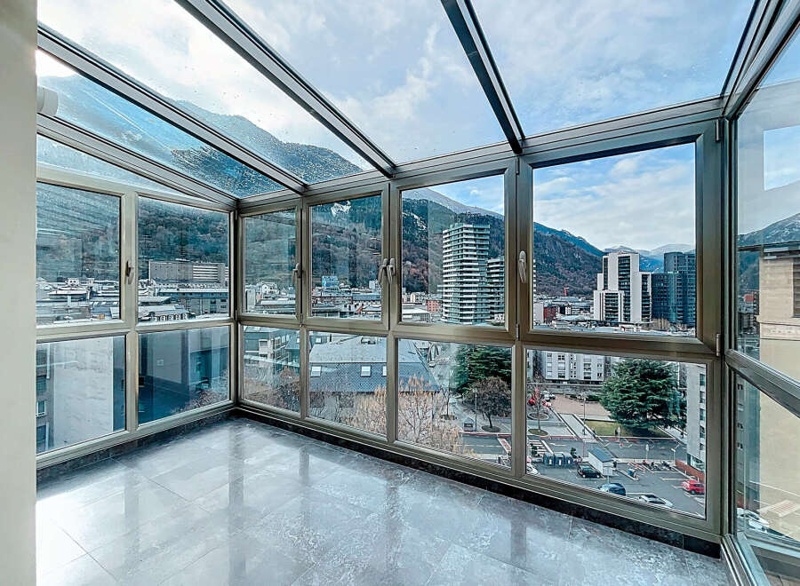 Experience breathtaking panoramic views from this stunning sunroom.