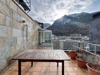 Enjoy breathtaking mountain views from this stunning rooftop terrace.