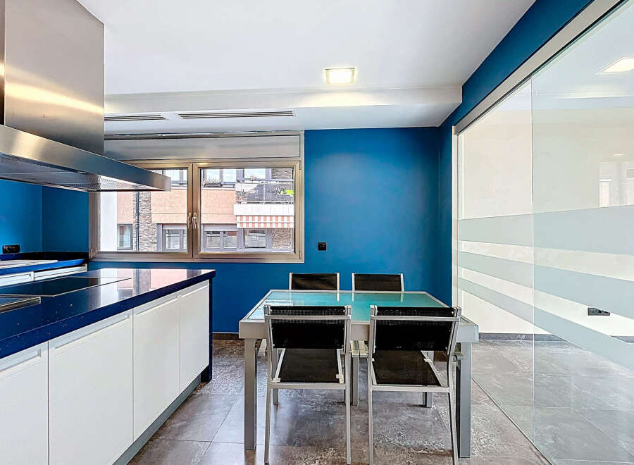 This modern kitchen boasts sleek design and functionality.