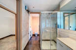 Step into this modern bathroom, featuring a sleek glass shower enclosure and contemporary design.
