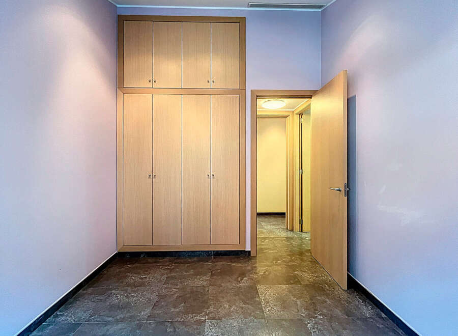 Discover this inviting space featuring a large built-in wardrobe, perfect for storage.