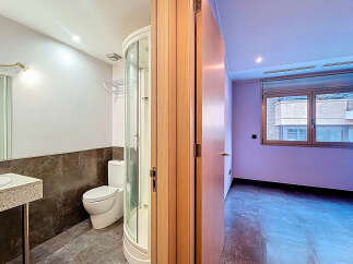 Step into this beautifully designed property featuring a modern bathroom with a sleek shower and a stylish vanity.