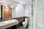 Step into this modern bathroom featuring a sleek design and contemporary fixtures.