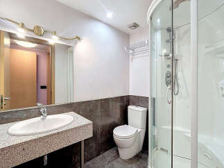 Step into this modern bathroom featuring a sleek design and contemporary fixtures.