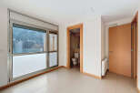 This bright and airy room features large windows that offer stunning views and ample natural light.