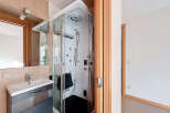 Step into a modern bathroom oasis! This property boasts a luxurious shower cabin, perfect for unwinding after a long day.