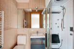 This modern bathroom features a sleek design with a combination of functionality and style.