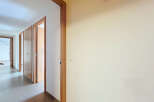 Discover the charm of this inviting hallway, featuring multiple doors leading to various rooms.
