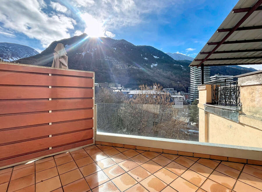 Enjoy breathtaking mountain views from this stunning balcony.