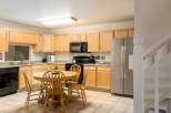 This charming kitchen features ample cabinet space, perfect for storage and organization.
