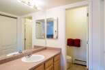 This well-maintained bathroom features a stylish vanity with ample storage and a sleek sink.