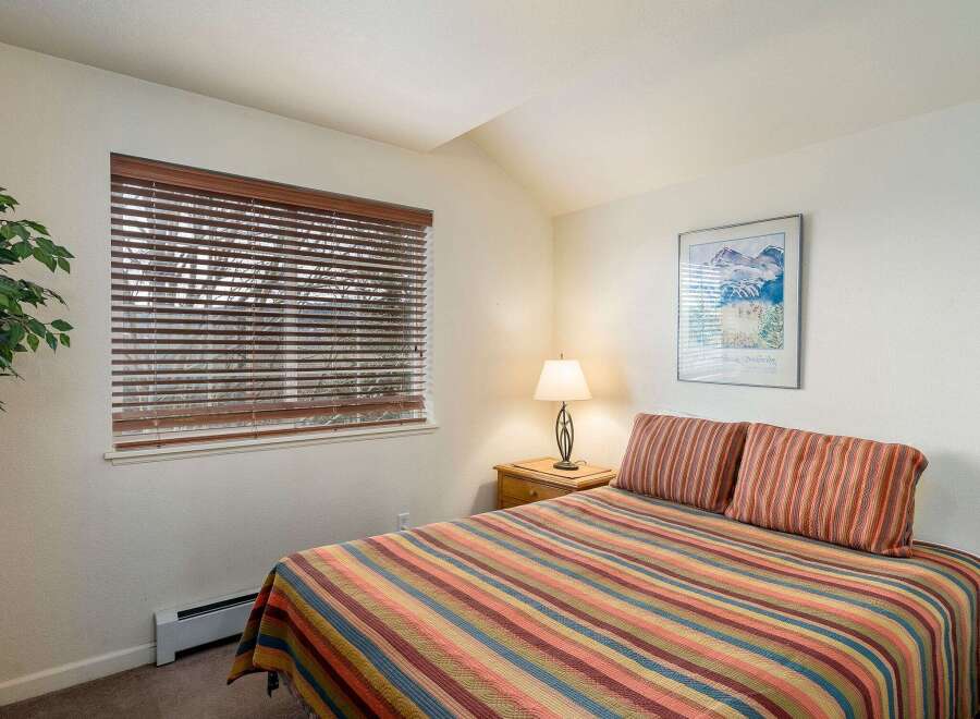 This cozy bedroom offers a tranquil retreat with its inviting ambiance.
