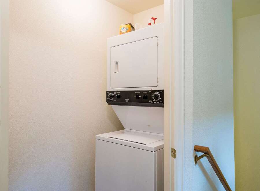 This property features a convenient stacked washer and dryer, perfect for efficient laundry days.