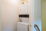 This property features a convenient stacked washer and dryer, perfect for efficient laundry days.