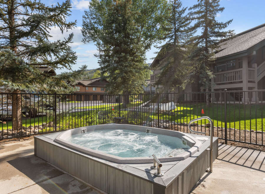 Enjoy a relaxing soak in this luxurious hot tub, perfect for unwinding after a long day.